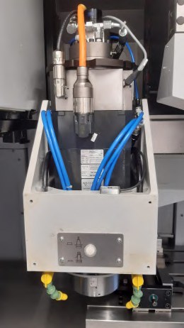 Wide view of the spindle housing of a machining centre with a vibration sensor mounted in the lower part of the housing